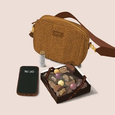 Dessin d'une boîte de chocolats et gourmandises à côté d'un sac à main, d'un téléphone et d'un téléphone portable.